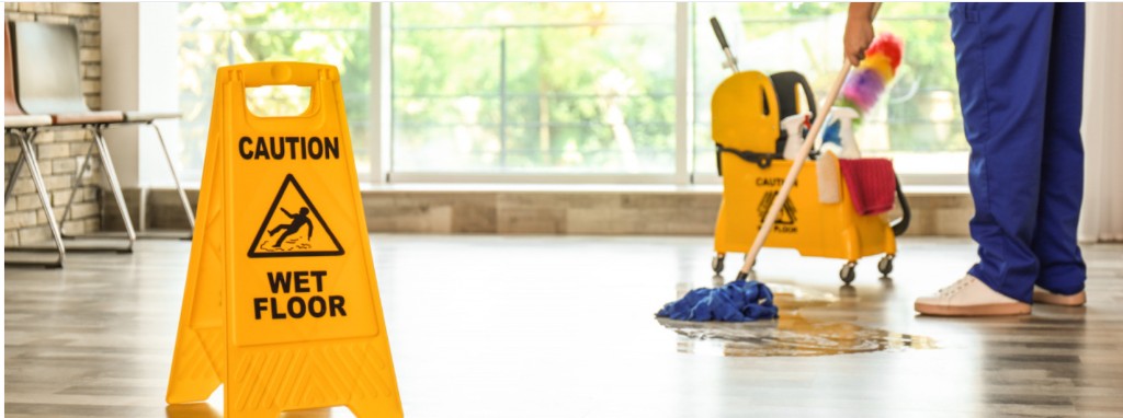 Caution wet floor sign with mopping